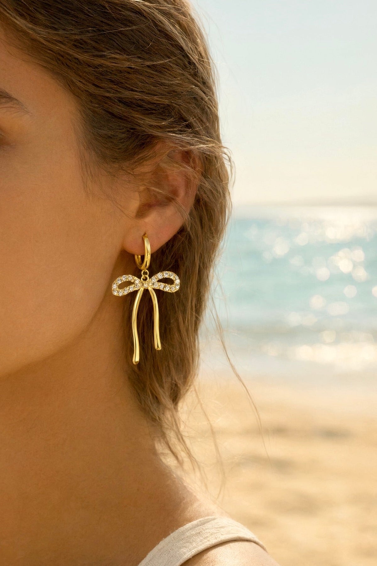 Boucles d'oreilles dorées noeuds