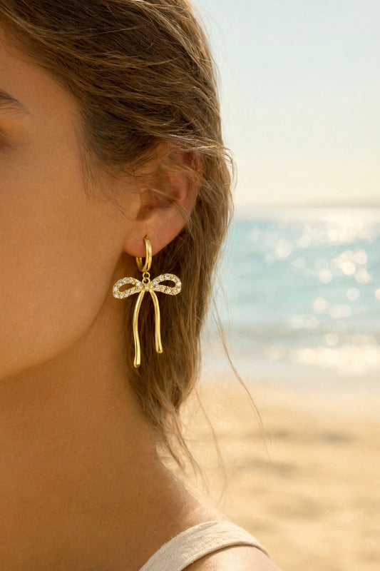 Boucles d'oreilles dorées noeuds